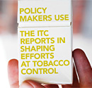 A hand holding a cigarette package with the message: Policy makers use the ITC reports in shaping efforts at tobacco control